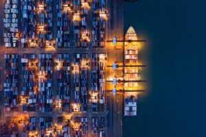 container cargo ship in the export and import business and logistics. Shipping to the harbor