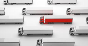 Fleet of new heavy trucks with one selected. Transportation